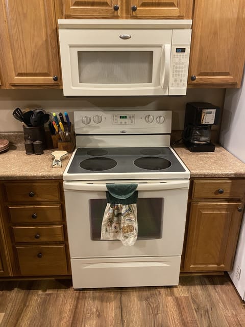 Electric range oven, microwave, coffee maker and all essentials.