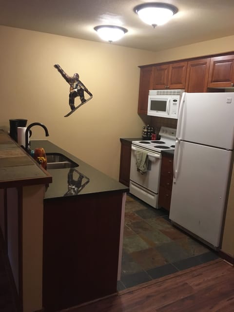 Fully stocked kitchen, with dishes, utinsels, and more.