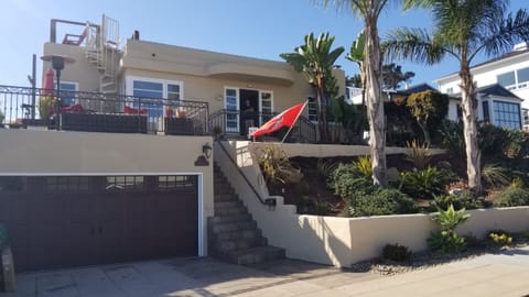 Front of the house with the new spiral staircase to the roof viewing deck