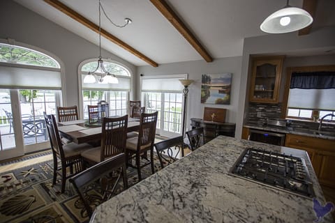 Large dining table and seating at kitchen bar