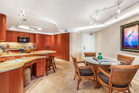 Looking into the kitchen from living room...entrance door to condo