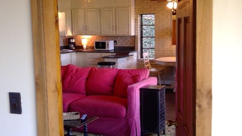 bedroom view of living room and kitchen