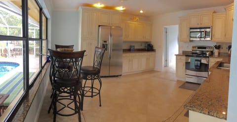 Seating area with view of the pool/patio area.