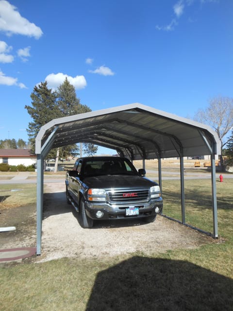 Nice sized carport you will want for the rainy afternoons we get.