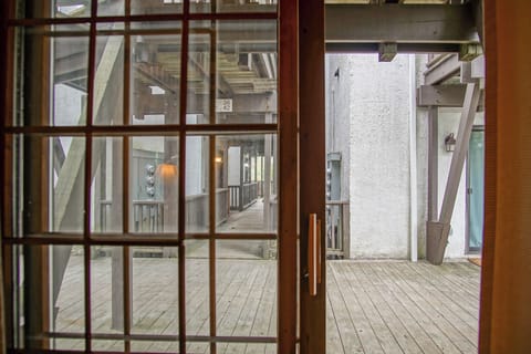 The patio doors lead out to the main walkway of this building!