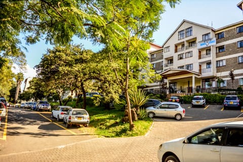 Property view from outside inclusive of parking area
