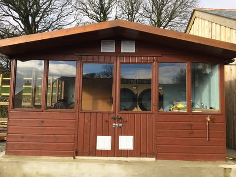 Shared Utility with tumble dryers and games cupboard