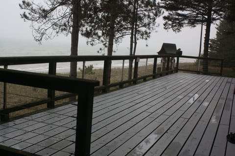 Comfortable chairs are provided on this freshly stained deck.