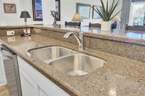 - Double stainless steel sinks make cleanup easy after family meals or snacks - Stylish granite countertops provide space to prep, serve, and gather around - Enjoy open views into the living space while staying connected as you cook
