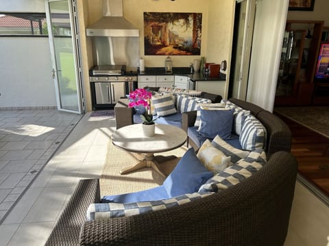 Lanai vaulted ceilings & fans seating for 6 with outdoor kitchen BBQ fridge sink