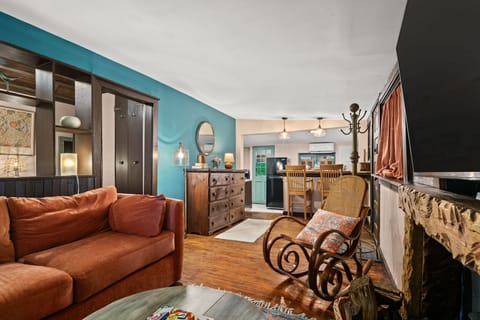 The Woodland Hideaway is a dog friendly cottage getaway with private backyard, 55" SmartTV and Fireplace. (wood provided)