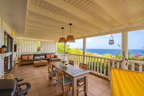 Enjoy spectacular views of the Caribbean Sea from the comfortable porch