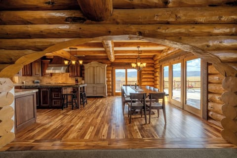 Entrance into kitchen and main dining table that. seats 10