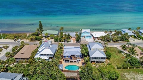 Best Location next to Waterfront Restaurant, Ice Cream & Shops! Water Views From Everywhere! 5 Bed/5 Bath, Huge Heated Pool, Separate Tiki Bar.