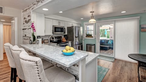 2nd Kitchen has Breakfast Bar, and separate hutch for food storage. 4 Stools for Seating.