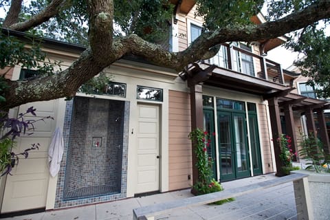 Outdoor shower and half bath. Upstairs master bedroom balcony