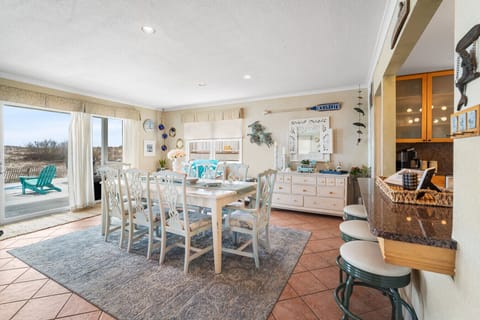 Spacious dining room with comfortable seating and easy access to the kitchen.