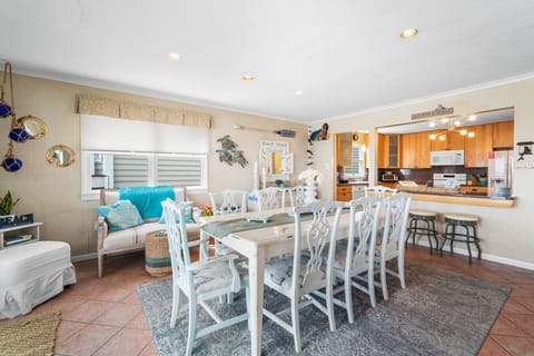 Open dining area connected to the kitchen, perfect for gathering and entertaining.