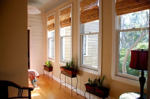 Upstairs hallway with views of the backyard and the rooftops of other homes.