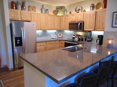 Quartz counter tops provide plenty of work space and serving areas.