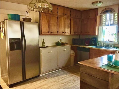 New solid plank flooring throughout great room including kitchen