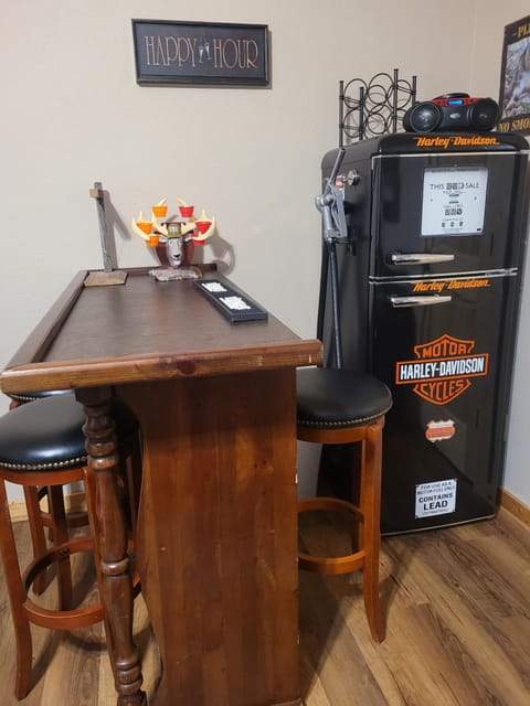 Bar with fridge located in downstairs rec room
