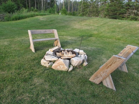 Fire pit with wood provided.
