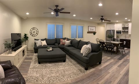 Open main living area. If needed, Queen blow-up mattress replaces ottoman.