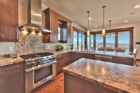 Thermador Stainless Steel Appliances Including a 4-Burner Gas Range and Refrigerator