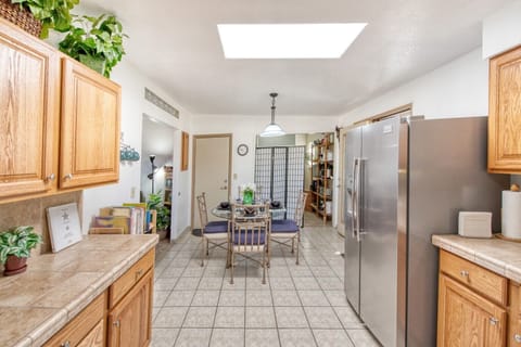 Bright & sunny kitchen with natural light from ceiling skylight.