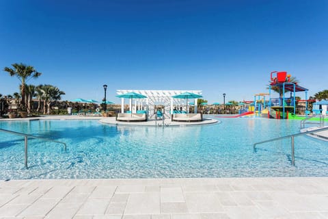 Enjoy serene pool views, contemporary design, and vibrant decor in this stunning 5-bedroom townhome.