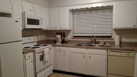 Open kitchen is fully furnished with all a cook could want!