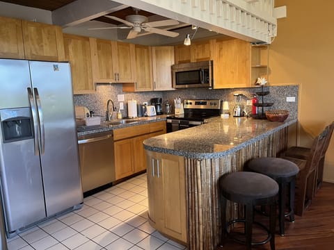 Fully stocked Kitchen area and bar.