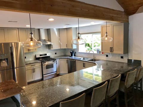 Exposed beams and Crate and Barrel lighting fixtures.  Plenty of seating. 