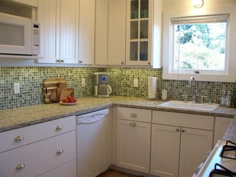 Kitchen area, with recycled glass tiles