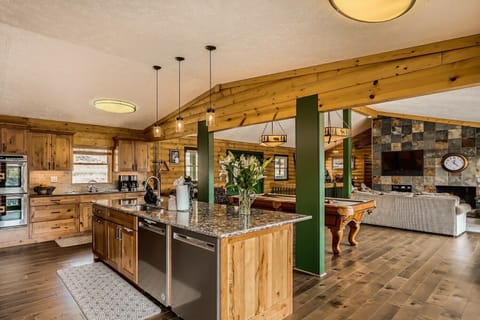 Kitchen with double ovens, 2 dishwashers, glass cook top, full size freezer and full size refrigerator, microwave