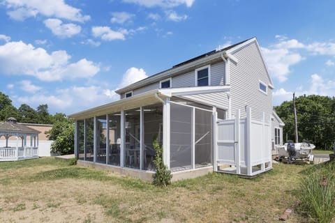 Albion has a huge Screened Porch with lots of seating and a hammock.