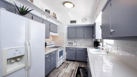 Kitchen, refrigerator with ice maker and water dispenser.