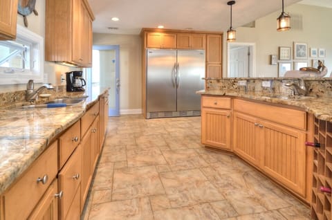 Professional refrigerator and two sinks 
