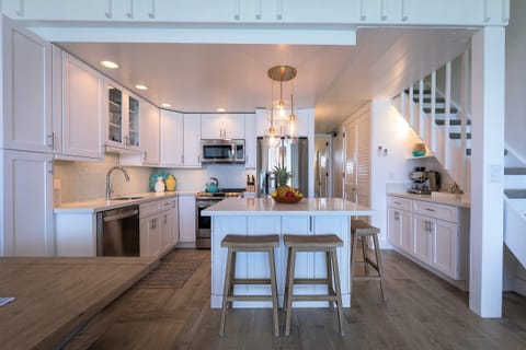 Gorgeous island kitchen with bar stools and lots of cabinets