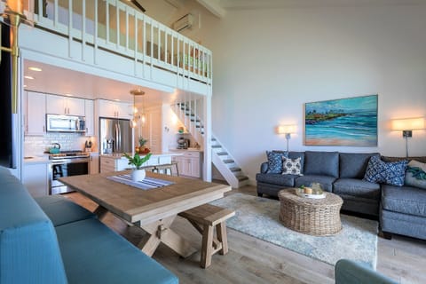 Driftwood table expands to sit 10. Stairs to loft bedroom.