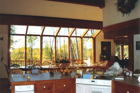 KITCHEN/DINING WITH SPECTACULAR FEW OF THE LAKE AND 8TH HOLE.
