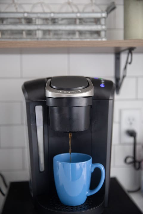 Keurig stocked with K Cups, sweetener, and creamer. Coffee maker available too.