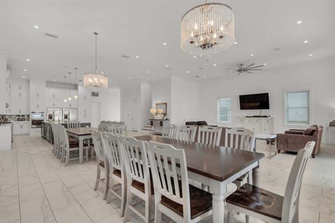 Seating 28 Guests, The Large Dining Area has 2 Tables for 10 each and 8 Barstools!