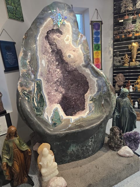 This beautiful Amythest geode throne  (chair) is located in the crystal shop