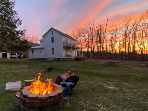 This is an outside view of the house at sunset at our fire pit. 