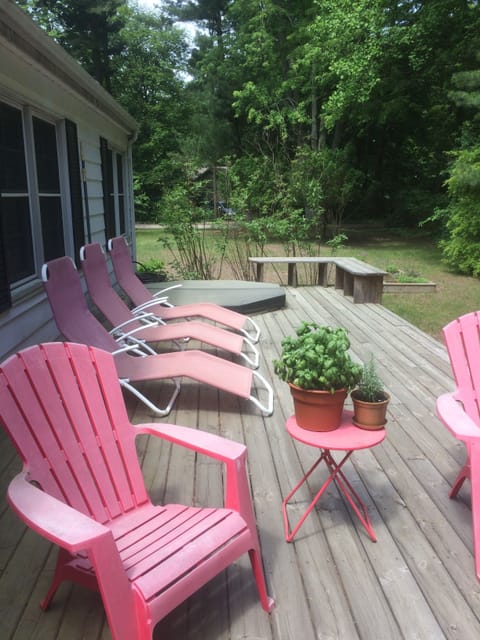 Back porch with chairs and hot tub