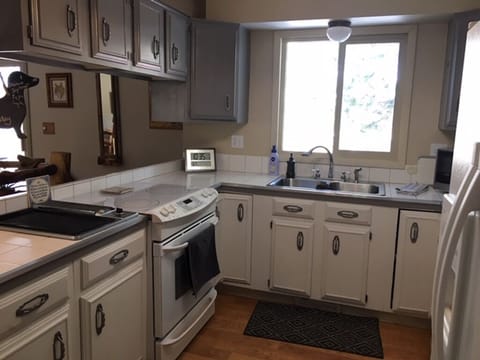 a roomy kitchen with all of the equipment and utensils you'll need