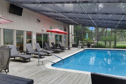 16' x 32' pool with 3' deep shallow end to 8' deep end. It's surrounded by a screened in deck with lounge chairs for 8 people and a dining table for 6. Heat with an extra fee!