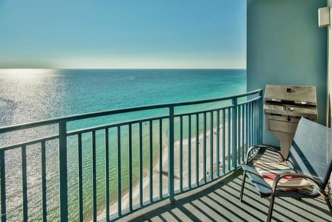 Sunset view of beach from balcony - Enjoy grilling fresh seafood on the patio!

